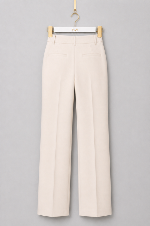 Back view of AURA ivory wide-leg tailored trousers featuring a high waist, clean tailored silhouette and welt pockets by Modella