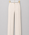 Front view of AURA ivory wide-leg tailored trousers featuring a high waist, front pleats and signature gold button by Modella