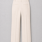 Back view of the ivory tailored trousers from the AURA women’s three-piece suit by Modella with welt pockets and wide-leg tailoring