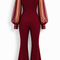 Back view of EVE burgundy jumpsuit by Modella showing the fitted silhouette, sheer sleeves and structured seam detailing