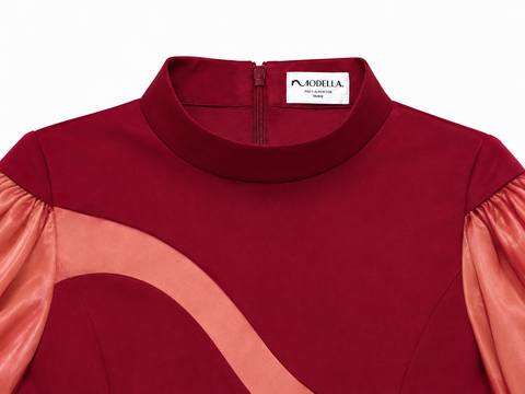 Close-up of EVE burgundy jumpsuit by Modella showing the interior Modella label, concealed zipper and gold fastening detail
