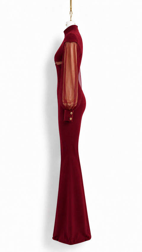 Side view of EVE burgundy jumpsuit by Modella showing the sculpted fitted silhouette, sheer sleeve and flared leg