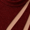 Close-up of LILIA red glitter dress by Modella showing the shimmering fabric, cutout detailing and Modella garment label