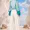 Back view of MAYA draped blouse and trouser set by Modella featuring printed chiffon and tailored ivory trousers