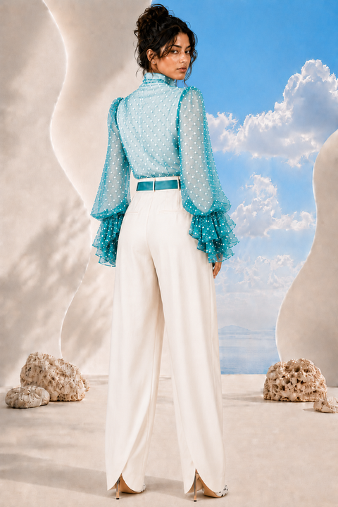 Back view of MAYA draped blouse and trouser set by Modella featuring printed chiffon and tailored ivory trousers