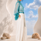Side view of MAYA draped blouse and trouser set by Modella showcasing fluid drape and elegant silhouette