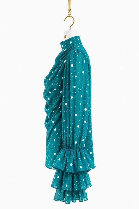 Teal MAYA polka chiffon blouse side view showing draped silhouette, gathered sleeve and layered ruffle cuff