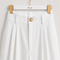 MAYA Rose modest set white tailored trouser waistband with belt loops and gold button, close-up by Modella
