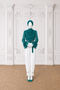 MAYA Teal luxury modest blouse and white tailored trouser set with draped polka print chiffon, ruffle sleeves and statement belt, front view by Modella