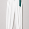 MAYA Teal set white tailored trousers with teal statement belt and sculpted ankle detail, front view by Modella