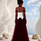 Back view of NYRA burgundy evening gown by Modella featuring layered tulle, structured bodice and elegant full length silhouette