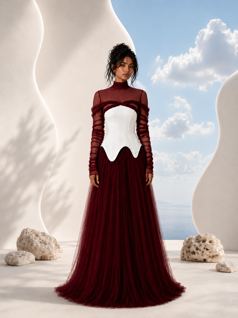 NYRA burgundy evening gown by Modella featuring a structured ivory bodice, layered tulle skirt and modest sheer upper construction