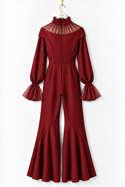Back view of the VERA burgundy high-low jumpsuit by Modella featuring a sheer pleated high-neck yoke, fitted waist, long sleeves with sheer flared cuffs and dramatic high-low flared legs